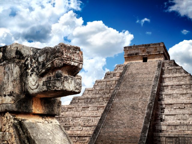 Mayan pyramid Chichen-Itza with Sacred Snake of Maya in the foreground. One of New7Wonders of the World. UNECSO World Heritage Site.