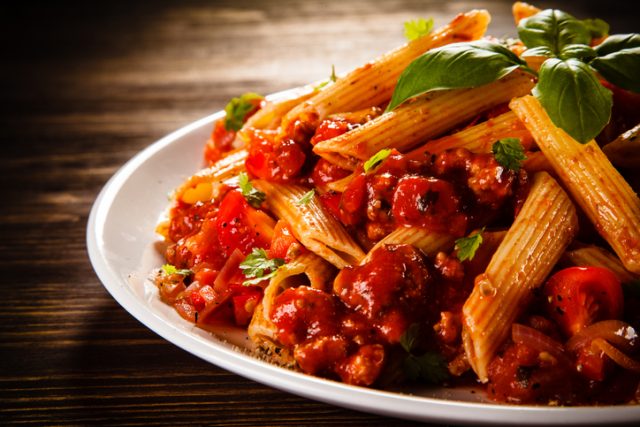 Pasta with tomato sauce and basil.