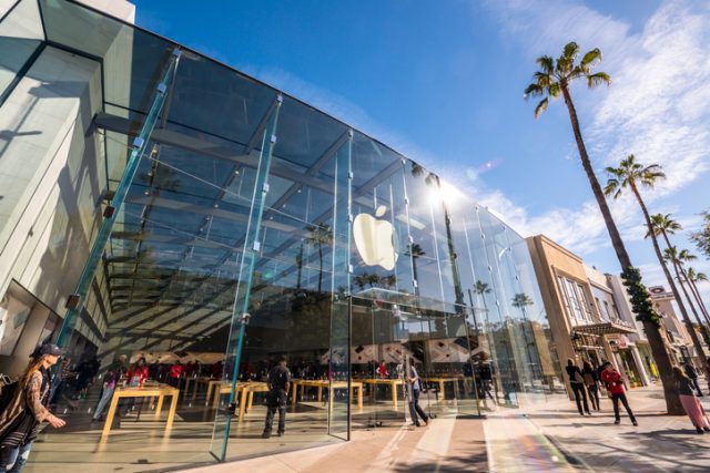 Santa Monica, USA – December 23, 2015: Apple Store on Third Street Promenade with people shopping inside and sightseeing outside on famous shopping street in Santa Monica downtown.