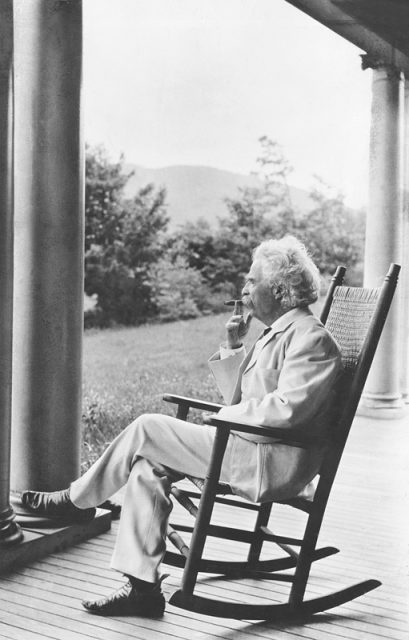 Mark Twain relaxing on a porch in New Hampshire.