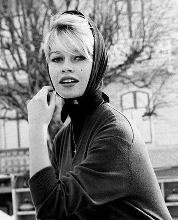 The French actress and model Brigitte Bardot posing on a curling field. Cortina d’Ampezzo