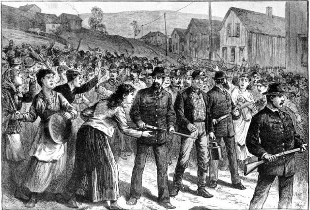 Pinkerton guards escort strikebreakers in Buchtel, Ohio, 1884.