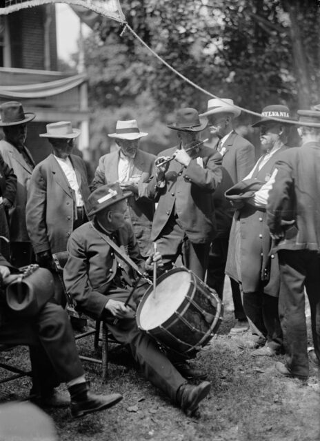 Group of men playing instruments together