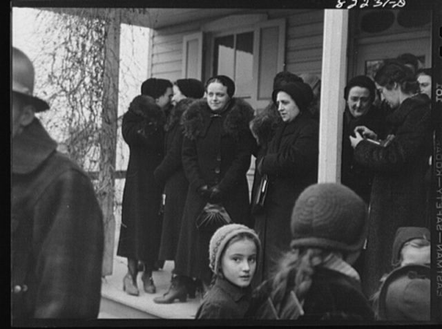 Amish and Mennonite women at a farm auction.