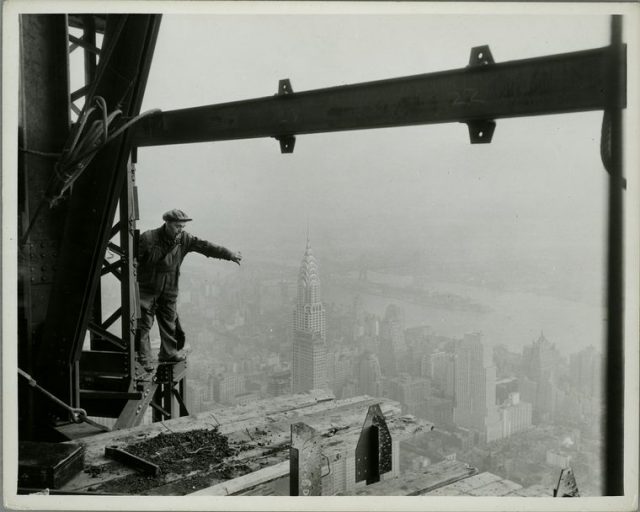 Atop the Empire State – in construction – Chrysler Bldg & [Daily] News in middle foreground.