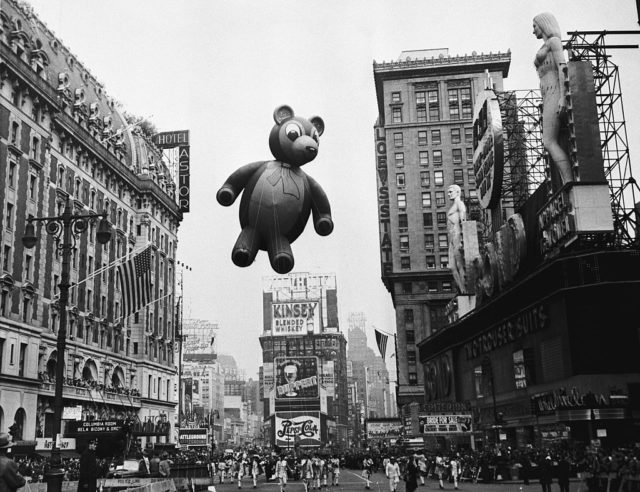 a teddy bear floats along the parade route