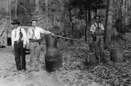 United States Revenue Officers with a captured still on Rich Mountain, Great Smoky Mountains National Park, November 18, 1931. National Park Service photograph by George A. Grant.