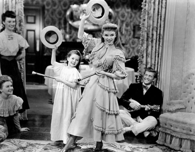 Margaret O’Brien and Judy Garland perform the song “Under the Bamboo Tree” in Meet Me in St. Louis.
