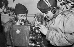 Two Navajo Code Talkers manning a portable radio