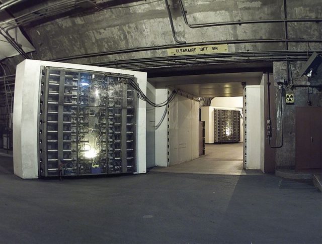 The 25-ton blast door in the Cheyenne Mountain nuclear bunker is the main entrance to another blast door (background) beyond which the side tunnel branches into access tunnels to the main chambers. NORAD, Cheyenne Mountain, Colorado.