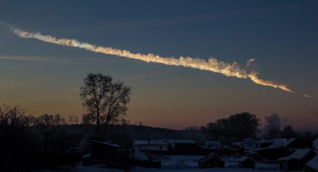 A meteor trace in a dusky sky.