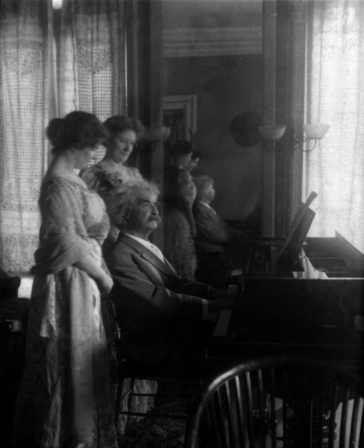 Twain with his daughter Clara and her friend.