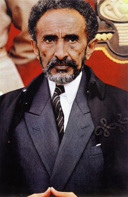 Emperor Haile Selassie standing in front of throne c.1965