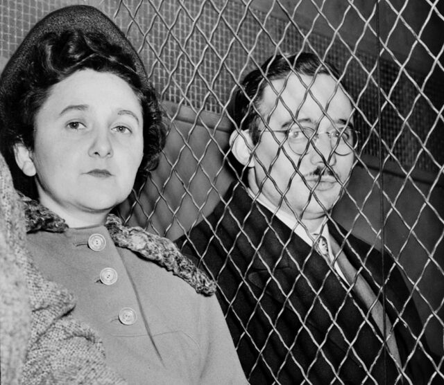 Ethel and Julius Rosenberg sitting together in the back of a police van