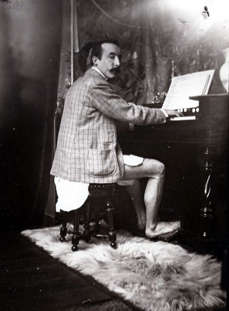 Gauguin, c. 1895, playing a harmonium at Alphonse Mucha’s studio at rue de la Grande-Chaumière, Paris (Mucha photo)