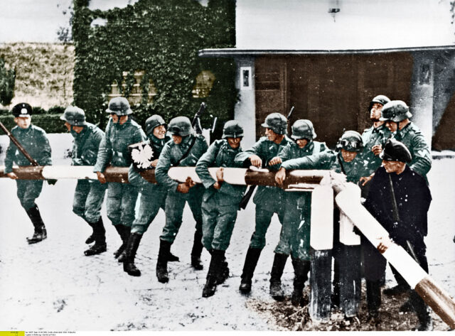 German soldiers breaking through a barrier