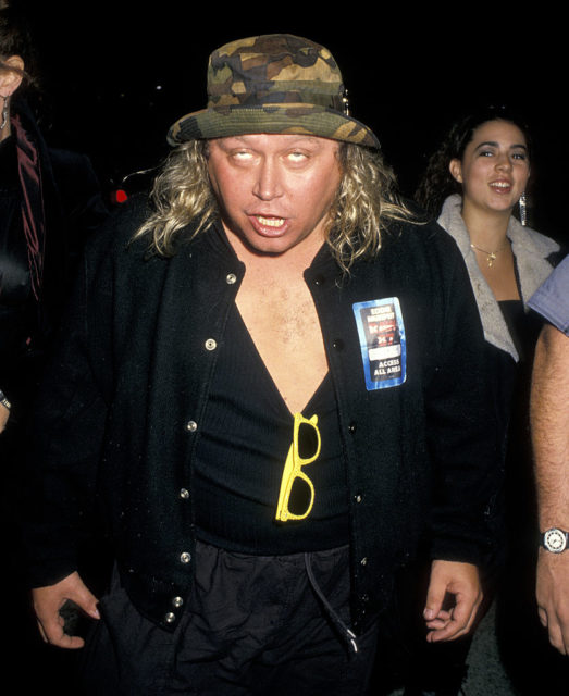 Sam Kinison rolling his eyes at the camera