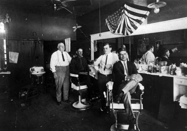 Interior of a barber’s shop, c. 1920.