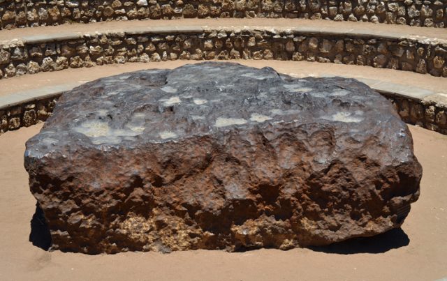 The Hoba meteorite is located close to Tsumeb and Grootfontein in Namibia, Africa. It measures 2.7×2.7×0.9 meters (8.9×8.9×3.0 ft), with mass estimated at 60 tonnes.