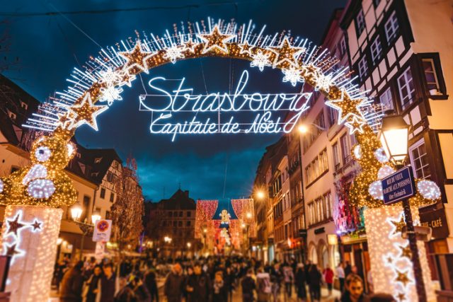 Entrance gate to the start of main shopping street and city centre of Strasbourg at Christmas time in Strasbourg, Alsace, France.