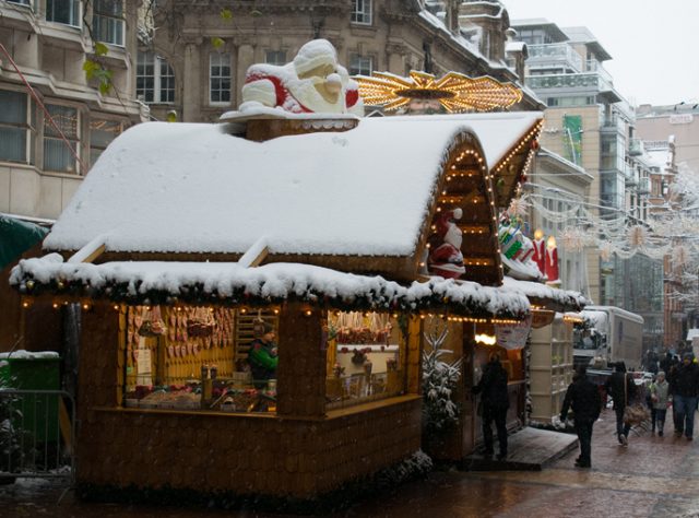 Birmingham, United Kingdom, December 10, 2017: City Centre, German Market on the snowy day, when it snowed for 16 hours without stopping. Although this photo was taken during opening times on the Sunday, when the Christmas market is normally crowded with people shopping, on this day it was almost empty due to cancelled buses.
