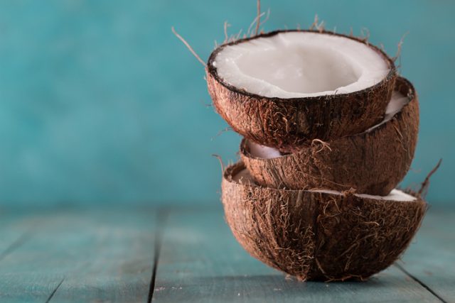 fresh coconuts on blue background,healthy food concept