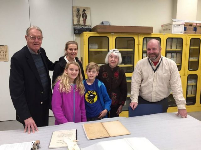 Heywood “Woody” Davis (from left) with his family presented the family’s Revolutionary War journal to historian Philip Mead at the Museum of the American Revolution in Philadelphia. Photo by Museum of the American Revolution