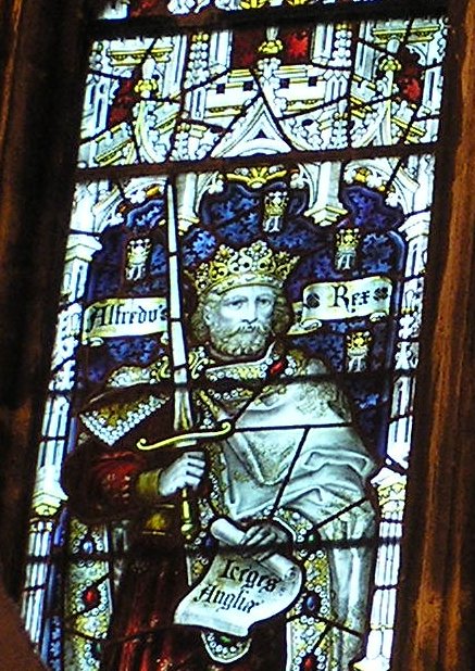 King Alfred the Great pictured in a stained glass window in the West Window of the South Transept of Bristol Cathedral. Photo by Charles Eamer Kempe.CC BY 3.0