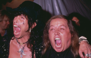 American singer Steven Tyler, frontman with rock band Aerosmith, and American comedian Sam Kinison