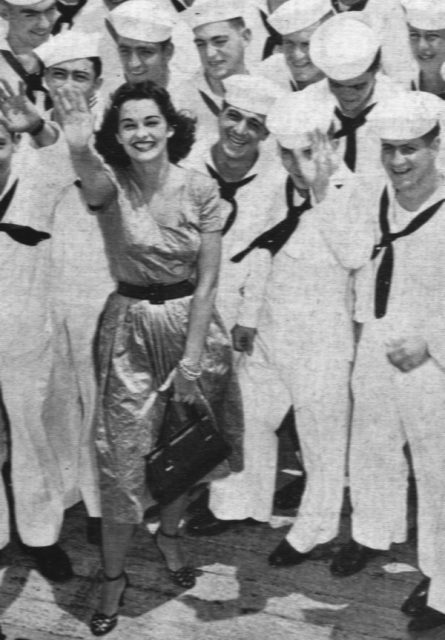 The 1951 Miss America, Yolande Betbeze, with U.S. Navy sailors aboard the light aircraft carrier USS Monterey (CVL-26).