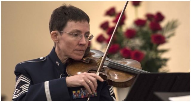 Chief Master Sgt. Deborah R. Volker performs during a Holocaust Commemoration. U.S. Air Force photo by Senior Airman Jordyn Fetter