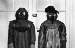 Two plague doctor uniforms.