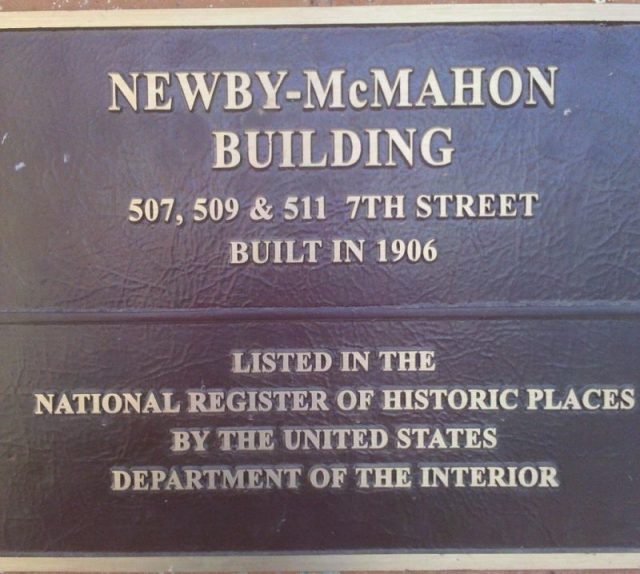 Plaque attached to the Newby-McMahon Building. Photo by Solomon Chaim CC BY-SA 3.0