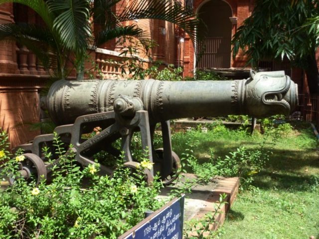 Side view of an ornate cannon.