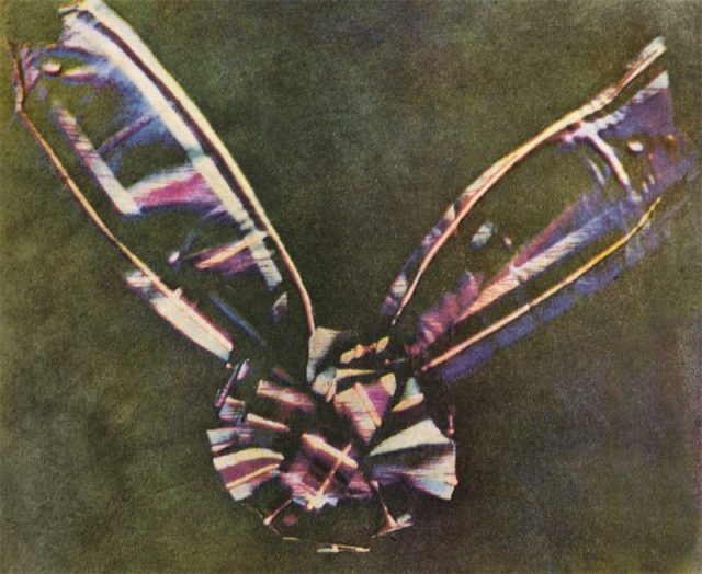 The first color photograph made by the three-color method suggested by James Clerk Maxwell in 1855, taken in 1861 by Thomas Sutton. The subject is a colored ribbon, usually described as a tartan ribbon.