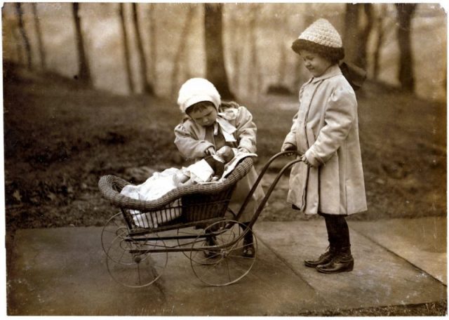 Children playing with Campbell Kid dolls.