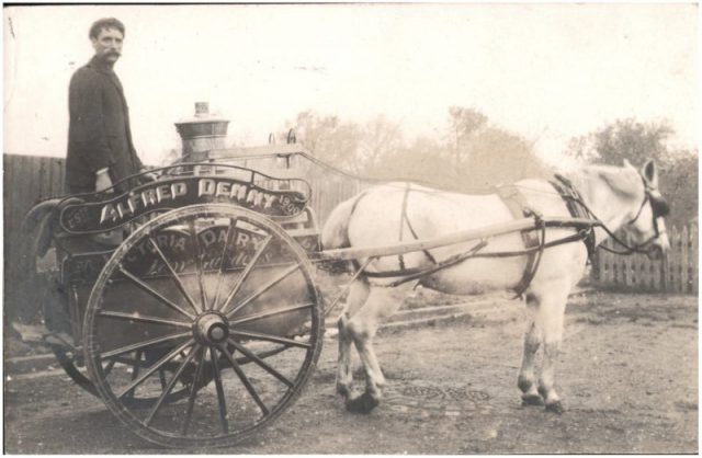Milkman and horse-drawn cart.