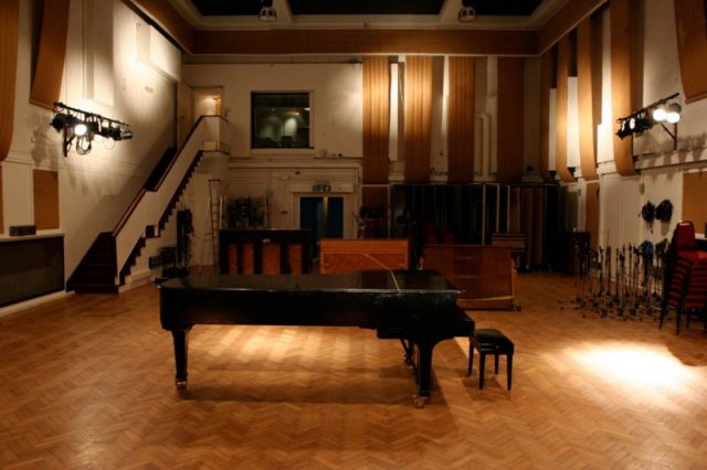 A grand piano and 3 other treasured pianos in Studio 2 of Abbey Road Studios, London. Photo by Tomswain CC BY-SA 3.0