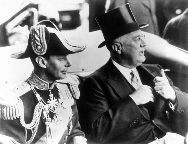 Close up of President Roosevelt and King George VI as they drive from Union Station to the White House. June 8, 1939.