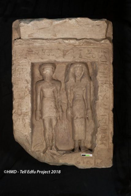 Limestone stela showing a man and women standing next to each other. Photo ©GM – Tell Edfu Project 2018