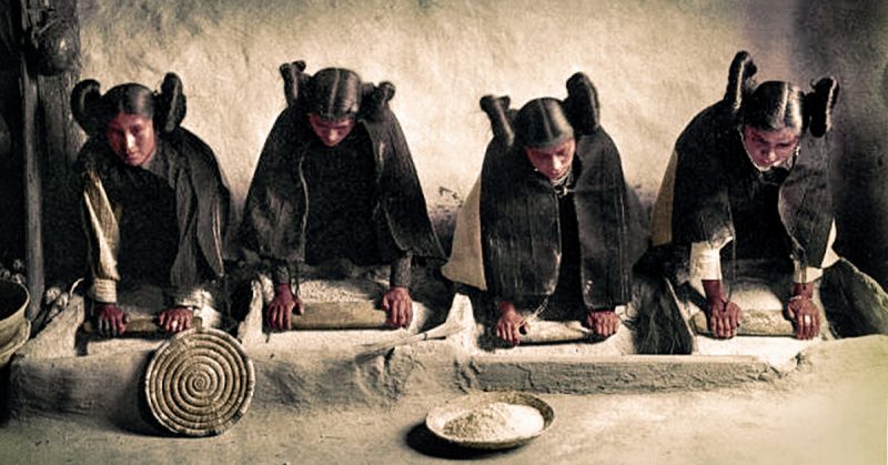 Four young Hopi Indian women grinding grain, c. 1906, photo by Edward S. Curtis
