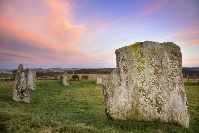 A winter day at a recumbent prehistoric stone circle in Aberdeenshire, Scotland, just after sunset. The Easter Aquhorthies Stone Circle was placed here some 4,500 years ago.