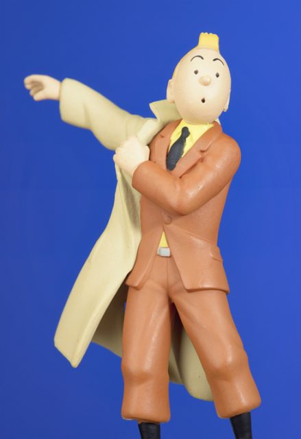 Edinburgh, UK – November 21, 2012: Close-up of an officially produced small plastic figurine of the fictional character Tintin. Tintin was created by the Belgian writer Georges Remi, who was better known by his pen name Hergé.