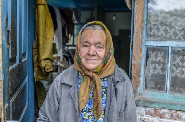 Chernobyl, Ukraine – August 27, 2012: A Ukrainian women who live in Chernobyl’s post-nuclear disaster “Zone of Alienation” or “Dead Zone” for more than 25 years. She lives with here husband 6km from the Reactor, in the less contaminated east side of the Chernobyl reactor. they live of self grown crop and vegetables.