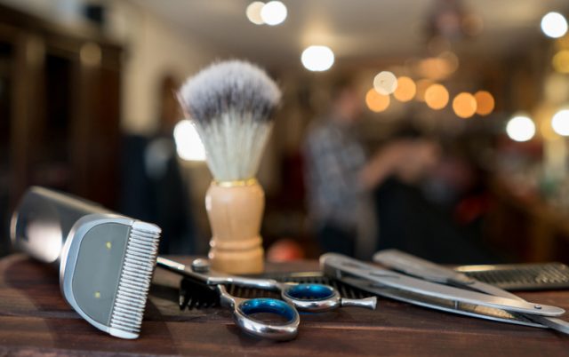 Close-up on a set of shaving tools at a barber shop – grooming kit concepts