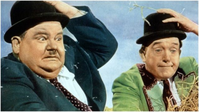 Oliver Hardy and Stan Laurel take a hay ride in movie art from the film 'The Bullfighters' (1945). Photo by 20th Century-Fox/Getty Images