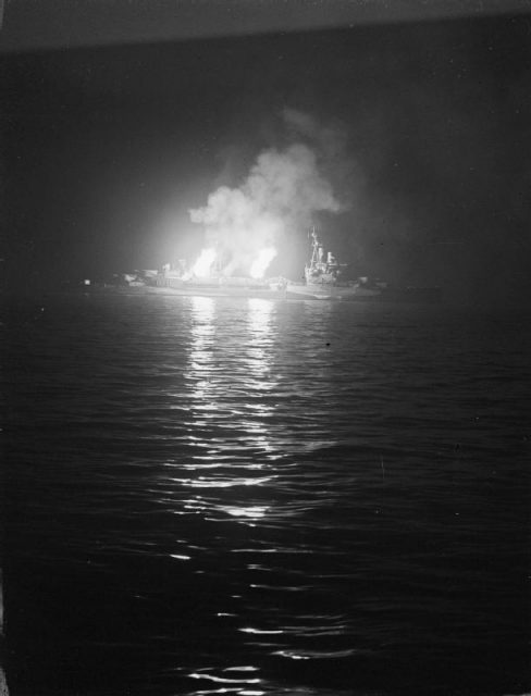 The cruiser HMS Belfast bombarding Juno on D-Day.
