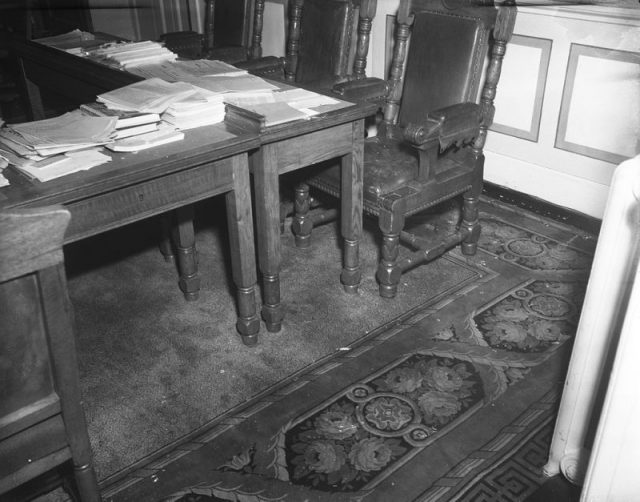 Broken glass lying by a chair inside Althingi, the Icelandic parliament. Photo taken on March 31, 1949, the day after rioting because a resolution was passed in order for Iceland to be a founding member of NATO.