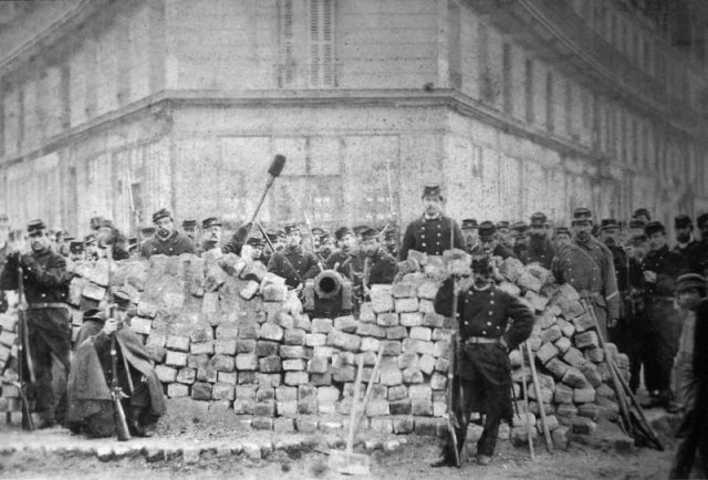 A barricade on Rue Voltaire, after its capture by the regular army, May 1871.