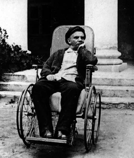 Lenin in 1923, in a wheelchair.
